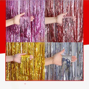 Detail of laser holographic wavy fringe curtain in purple, rose gold, gold and silver