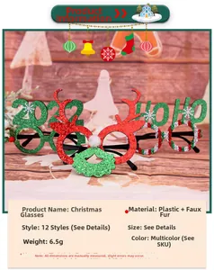 Detailed view of Christmas party glasses with glitter reindeer antlers and festive pom-poms