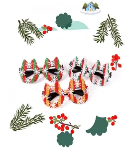 Close-up of glittery Christmas party glasses with snowflakes and striped festive patterns