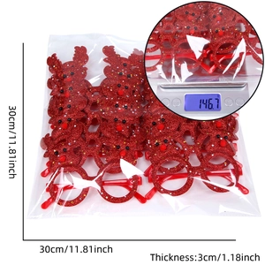 Detail of bulk red glitter reindeer glasses in packaging with dimensions and weight info