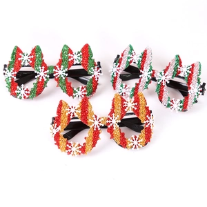 Three assorted glittery Christmas glasses frames with reindeer ears and snowflake patterns
