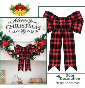 Classic red and black buffalo plaid Christmas bow displayed on a festive wreath and door