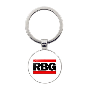 Close-up of silver keychain pendant with RBG lettering and red stripe details