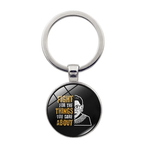 Close-up of Ruth Bader Ginsburg keychain with Fight For The Things You Care About quote