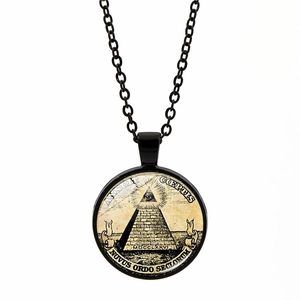Close-up of steampunk Masonic pendant with All-Seeing Eye and Annuit Coeptis engraving