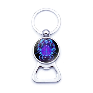 Polished metal bottle opener keychain with a blue Cancer zodiac artistic sign