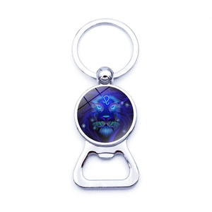 Detailed close-up of a metal bottle opener keychain with Leo zodiac art glass dome