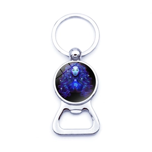 Macro view of Virgo zodiac glass dome on a polished silver metal beer bottle opener keychain