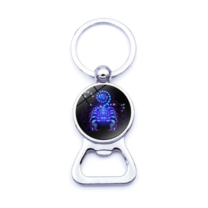 Macro shot of Scorpio zodiac glass gem keychain with integrated beer bottle opener