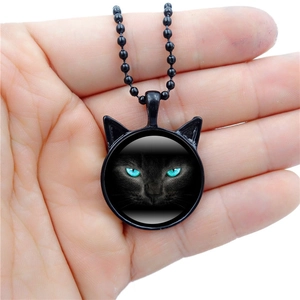 Vintage black cat glass pendant necklace with cat ear frame and green eyes on ball chain