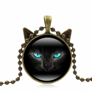Vintage bronze cat ear necklace with black cat glass cabochon on a long beaded chain