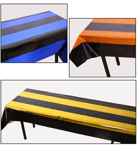 Detail of metallic striped Halloween table runners in blue, orange, and yellow foil