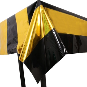 Shiny black and gold striped Halloween party tablecloth with metallic foil finish
