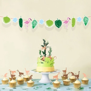 Tropical party decoration kit with flamingo palm leaves and monkey cupcake toppers