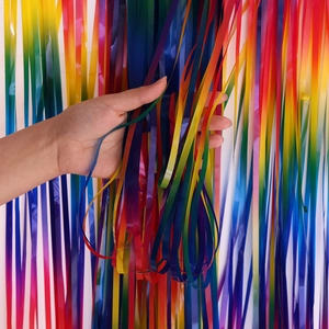 Detail showing the texture and soft drape of macaron rainbow foil fringe curtain