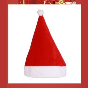 Close-up of soft plush Christmas hat with a classic red body and white pom-pom detail