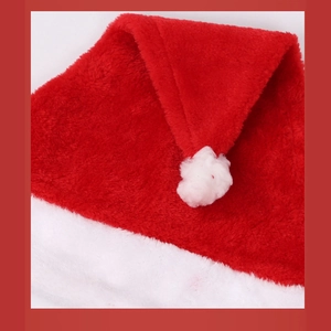 Detailed close-up of soft red plush fabric and white faux fur trim on a Christmas hat