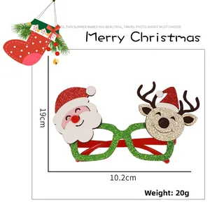 Detail view of festive glittery green Christmas glasses featuring Santa and reindeer motifs