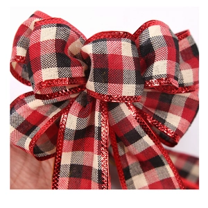 Macro shot of red and black plaid Christmas bow with refined wired edges for shaping
