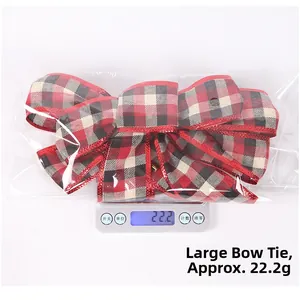 Macro view of a large red and black plaid Christmas bow weighing 22.2g on a digital scale