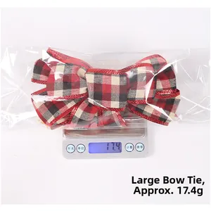 Close-up of a large red and black plaid Christmas bow ornament on a digital scale