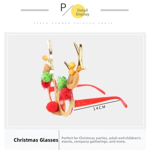Detailed view of red Christmas glasses with gold antlers and festive pom-poms 14cm width