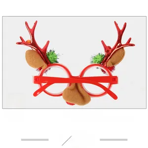 Close-up of festive red reindeer antler glasses with soft felt ears and green pom-poms
