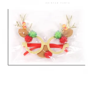 Christmas glasses with golden reindeer antlers and pom-poms measuring 21cm by 17cm