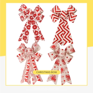 Detailed view of four festive Christmas bows with reindeer, bells, and stripes patterns
