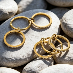 Minimalist gold multi-ring set with micro-pave cubic zirconia on grey pebble stones