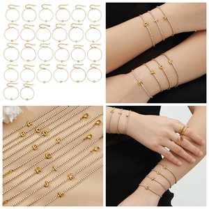 Close-up of 18k gold plated 26 letter tennis bracelets with cubic zirconia insets