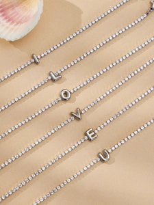Sparkling zircon tennis bracelets spelling I LOVE U in polished silver finish