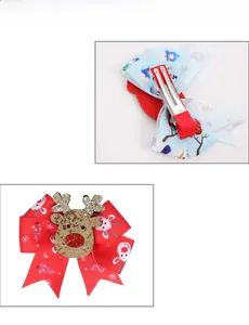 Detail of Christmas reindeer hair clip with red ribbon bow and silver metal duckbill clip