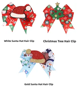 Detailed view of Christmas bow clips with Santa hat, tree, and snowman designs
