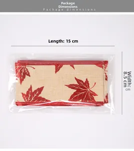 Detailed view of maple leaf ribbon packaging with dimensions 15cm length and 8.5cm width