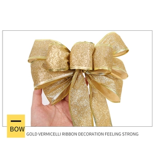 Große goldene Glitzerschleife für Weihnachtsbaum und Geschenkboxen mit Metallkanten