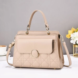 Elegant beige quilted handbag with gold hardware and spacious multi-layered interior
