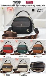 Detail view of the multi-layer interior and adjustable strap of the square leather bag