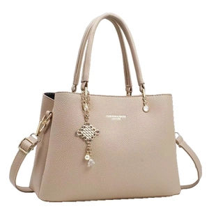 Elegant beige lychee grain leather tote bag with gold lettering and pearl charm