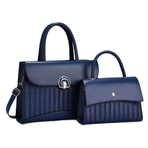 Navy blue woven tote bag and crossbody pouch set with a metal twist lock closure