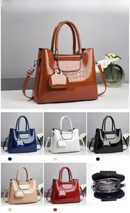 Close-up of luxury stone pattern patent leather handbag with elegant brand logo detail
