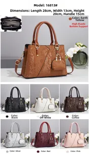 Detail view of snakeskin pattern tote with interior compartments and seven color options