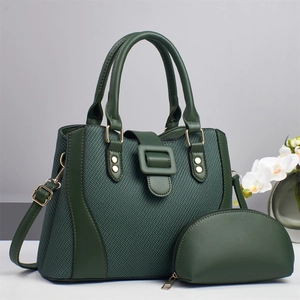 Detail of forest green tote and matching pouch set with premium woven texture and gold hardware