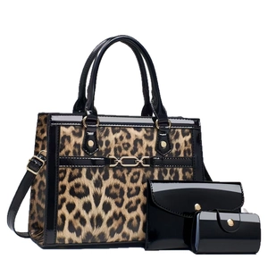 Three-piece leopard print tote bag set with black patent leather trim and gold hardware
