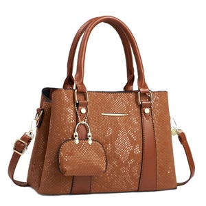 Brown faux snakeskin tote bag with matching mini coin purse and gold hardware detailing