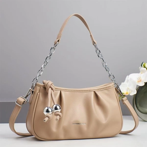 Elegant beige pleated cloud bag with silver chain strap and stylish tassel detail