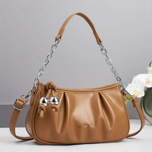 Caramel pleated cloud bag with chunky silver chain and long strap for shoulder or crossbody use