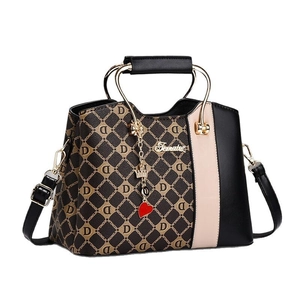 Chic color-block handbag with monogram print, gold handles and detachable shoulder strap