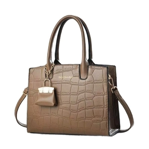 Brown faux crocodile leather handbag with mini charm and Fashion & Bag lettering