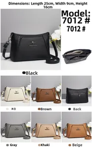 Detailed view of large capacity faux leather shoulder bag with multiple compartments